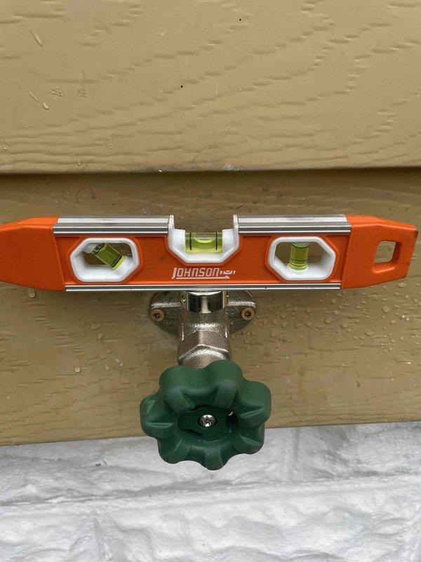 Responded to callback for leaking hose bib handle. Upon inspection, verified active leak at valve stem packing. Replaced worn packing nut and stem washer on exterior hose bib, tested operation of valve handle for proper function, and confirmed no leaks present after repair completion.