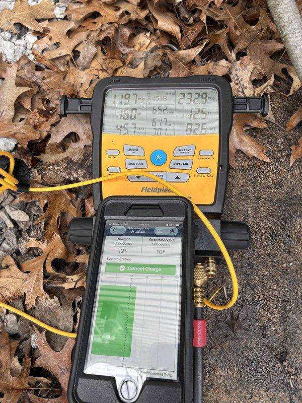 Performed system start-up and diagnostic testing on residential air conditioning unit. Utilized digital manometer and Fieldpiece diagnostic equipment to measure system pressures, temperatures, and verify proper refrigerant charge. Confirmed system operating parameters with superheat reading of 119.7°F and subcooling of 232.9°F, with diagnostic tool indicating correct charge status. System tested and verified operational.