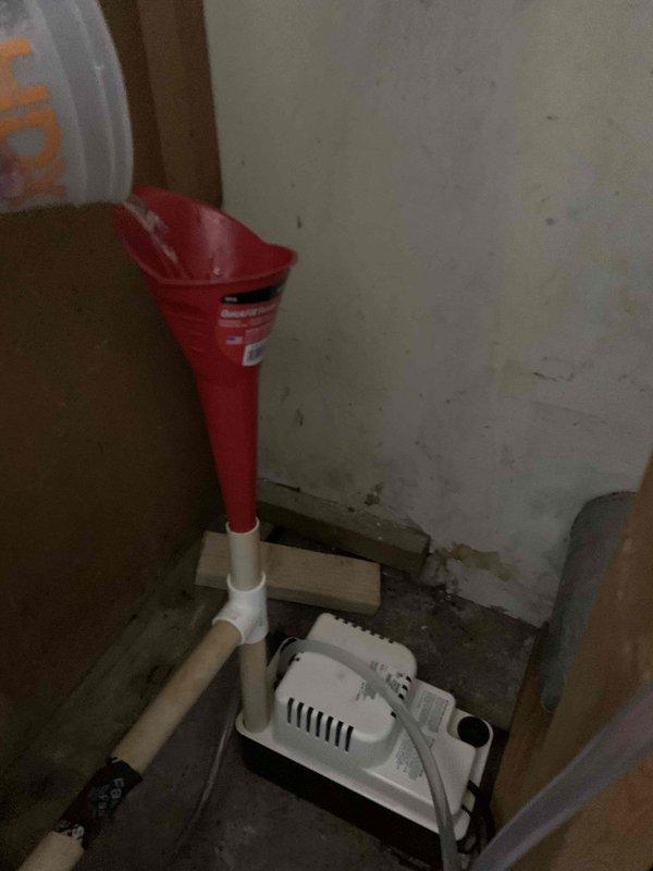 Responded to service call for cooling maintenance member reporting CO2 detector alarms during nighttime hours. Performed system inspection and documented condensate pump operation in utility area, verifying proper drainage function and equipment placement. Inspected carbon monoxide detection device on floor level, noted unit condition and surrounding area cleanliness for safety assessment.