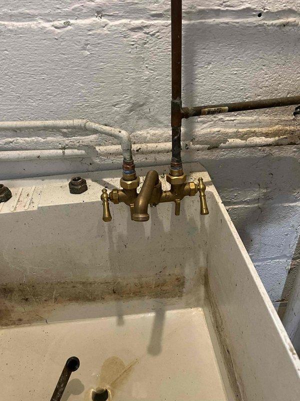 Addressed multiple plumbing issues throughout the property, including repairing a leaking outdoor spigot at the base, servicing an aging hot water supply line at the basement washer tub, and clearing a slow-draining main floor bathroom sink. Applied senior and veteran discount to the service call.