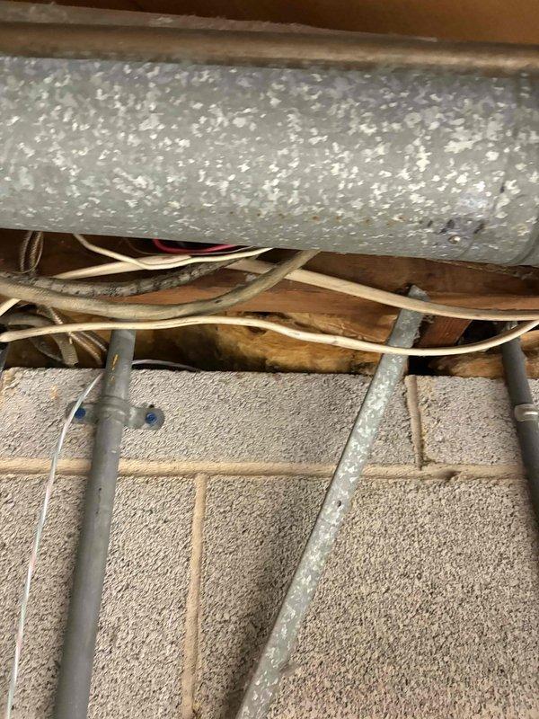 Completed HVAC estimate for air conditioning system addition to existing property with gas furnace less than 10 years old. Assessed attic space and basement utility area for new air handler installation, evaluating existing ductwork configuration, electrical wiring pathways, and structural framing to determine optimal equipment placement and integration requirements. Documented current infrastructure conditions including metallic supply ducts, electrical conduit routing, and available clearances for new AC system components.