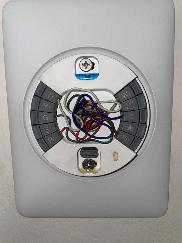 Responded to no cooling complaint on attic-mounted air handler unit. Found Y1 wire improperly connected at thermostat terminal, causing system communication error and preventing compressor operation. Corrected Y1 wire termination at thermostat, verified proper connection at air handler control board, and confirmed system returned to normal cooling operation.