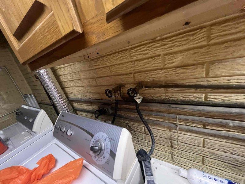 Performed routine maintenance flush on tanked water heater to remove sediment buildup and ensure optimal performance. Inspected drain pan and surrounding components, noting accumulation of debris and mineral deposits that were addressed during the service. Unit returned to normal operation with improved efficiency.