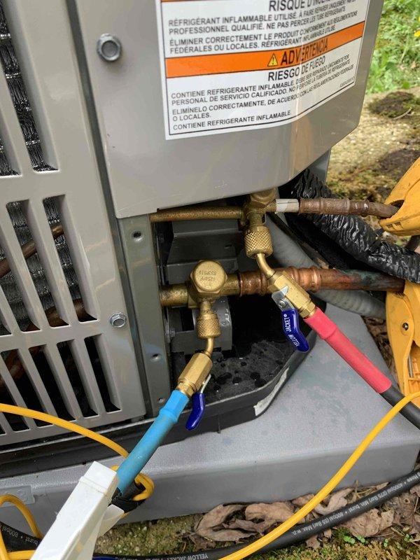 Completed cooling maintenance club visit on air handler system. Connected manifold gauges to service ports and performed refrigerant system diagnostics. Added UV dye to the system for future leak detection purposes and documented the service with notation on equipment cabinet. Inspected outdoor unit components, refrigerant line connections, and copper fittings for proper operation and condition.