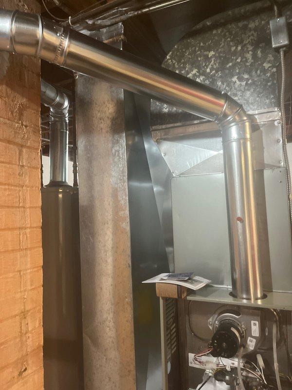 Completed furnace installation in basement utility area with new air handler unit and associated ductwork. Installed and leveled white PVC condensate drain line along interior wall, verified proper pitch using precision leveling equipment. Connected metallic supply ductwork from furnace plenum to existing distribution system, ensuring proper airflow throughout residence. Secured all mechanical connections, verified blower motor operation, and confirmed system readiness for operation.