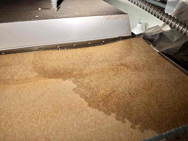 Responded to water leak originating from a 3/4-inch pipe in the attic utility area. Upon inspection, identified active leak causing water damage to carpet below HVAC equipment, with visible moisture staining and discoloration present on flooring surface. Assessed pipe condition and surrounding wooden structural components in attic space. Documented existing water damage patterns on carpet beneath unit, noting irregular staining consistent with ongoing leak from overhead plumbing. Captured photographic documentation of affected areas including pipe location, ductwork proximity, and extent of water infiltration to flooring materials for service records.