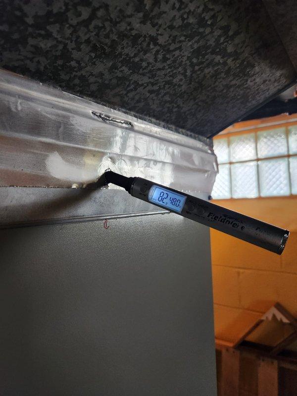 Completed cooling maintenance club visit on air handler system. Upon inspection, discovered significant ice buildup on evaporator coil with temperature reading of 62°F, indicating restricted airflow or refrigerant issue. Measured static pressure at 0.12 inches water column, confirming airflow restriction. Documented conditions with photos showing frozen coil and pressure readings for further diagnostic evaluation and necessary repairs.