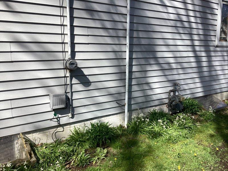 Responded to no-heat emergency call and conducted comprehensive site assessment of existing HVAC system. Documented current outdoor condensing unit installation, including electrical disconnect configuration and conduit routing along building exterior. Evaluated existing equipment placement on concrete pad with proper clearances and accessibility. Photographed system components and surrounding infrastructure to develop accurate replacement specifications. Prepared detailed estimate for complete system replacement to restore heating functionality.