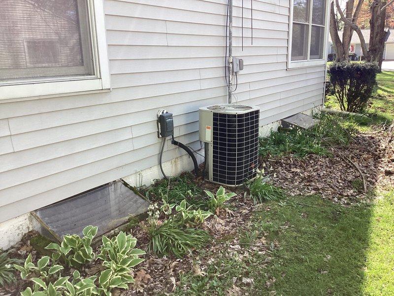 Responded to no-heat emergency call and conducted comprehensive site assessment of existing HVAC system. Documented current outdoor condensing unit installation, including electrical disconnect configuration and conduit routing along building exterior. Evaluated existing equipment placement on concrete pad with proper clearances and accessibility. Photographed system components and surrounding infrastructure to develop accurate replacement specifications. Prepared detailed estimate for complete system replacement to restore heating functionality.