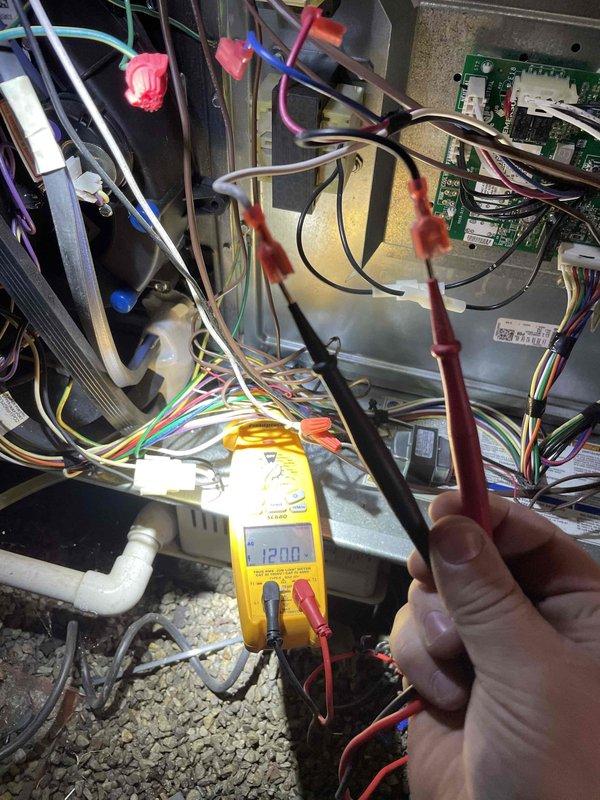 # Emergency No Heat Call - Furnace Diagnostic

Responded to emergency no heat call for furnace with unknown age. Upon arrival, performed complete system diagnostic to identify cause of heating failure. 

Inspection revealed heavily soiled air filter with significant dust and dirt accumulation throughout pleated media, restricting airflow to system. Noted moisture condensation present on interior metal panels of air handler compartment. Accessed internal electrical components and control boards to perform voltage testing using digital multimeter. Measured system voltages at multiple test points to verify proper electrical supply and component operation. Inspected wiring connections, control board, and safety circuits for proper function.

Identified dirty filter as contributing factor to system shutdown, likely triggering safety limit switch due to restricted airflow and overheating conditions. Replaced air filter with new pleated media to restore proper system airflow. Verified all ele