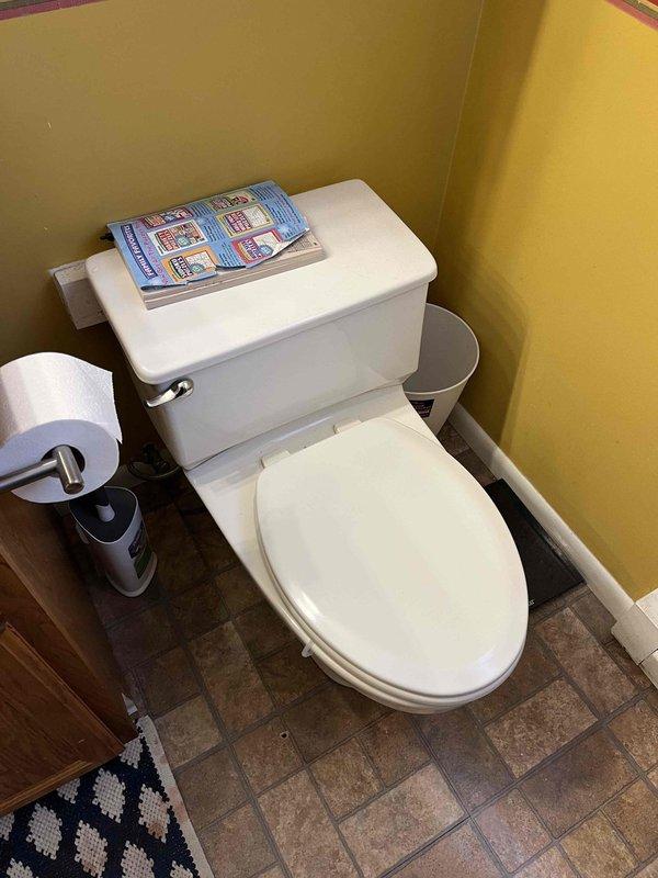 Installed two new shut-off valves for toilet water supply lines and secured loose toilet by tightening bolts at the base to ensure stable mounting to the floor flange. All connections were tested for proper operation and leaks.