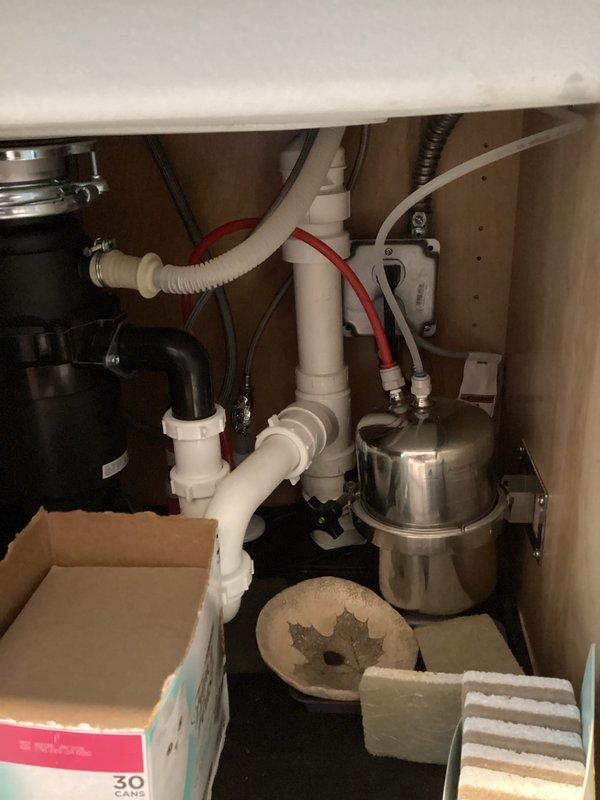 Completed six-month follow-up inspection on previously installed water softener system. Verified proper operation of tankless water heater and associated copper supply lines in basement installation. Inspected under-sink plumbing connections, water supply lines, and filtration system components to ensure all equipment is functioning correctly with no leaks or performance issues detected.