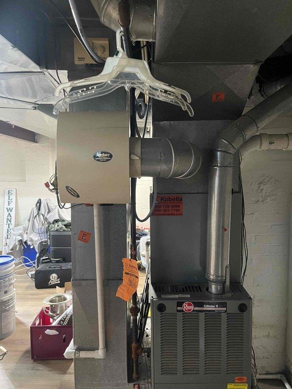 Completed full HVAC system replacement in basement utility area, installing new Rheem Climate II furnace with integrated ductwork modifications. Installed Aprilaire humidification system and configured all mechanical connections, ensuring proper ventilation and system integration for optimal heating and cooling performance.