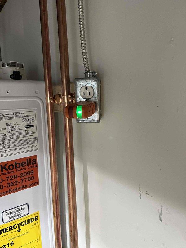 Installed under-sink water filtration system in kitchen and replaced existing kitchen faucet. Completed installation of tankless water heater with copper supply lines, proper venting, and electrical connections, including wall-mounted monitoring sensor with indicator light.