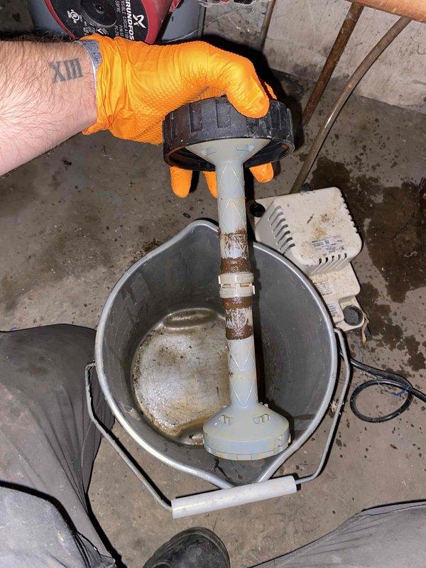 Responded to service call for boiler making noises when reaching operating temperature. Upon inspection, discovered failed condensate pump with significant corrosion on pump mechanism and sediment accumulation in collection basin. Removed and replaced defective condensate pump unit. Cleared drain lines and tested system operation through complete heating cycle to verify proper condensate removal and confirm noise issue was resolved.