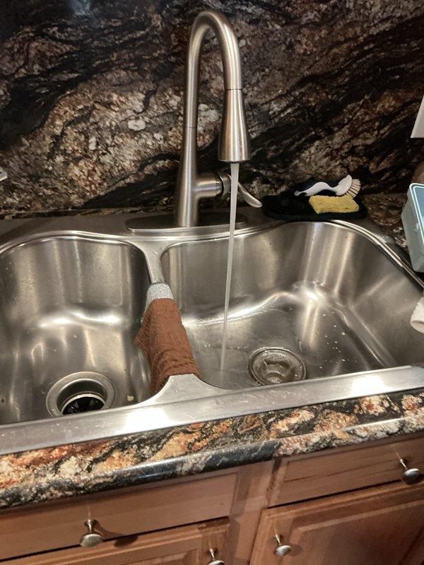 Responded to service call for leaking hot water tank in 17-year-old residential property. Conducted visual inspection of water heater unit and surrounding plumbing connections to identify source of leak. Documented existing conditions with photographs for warranty verification purposes, as unit age falls within potential manufacturer warranty coverage period. Assessed leak severity and provided homeowner with recommendations regarding warranty claim process and potential replacement options given the age of the equipment and home.