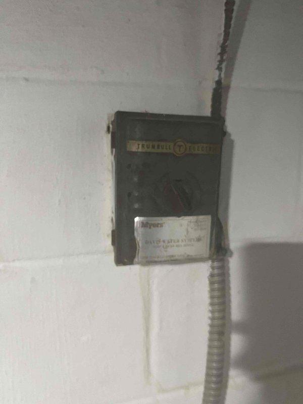 Diagnosed low water pressure issue caused by aging well pump system experiencing frequent cycling due to pressure loss. Inspected existing well pump pressure control equipment, including vintage Trumbull Electric pressure switch showing significant age and wear. System assessment revealed pressure retention problems causing pump to activate repeatedly, indicating likely failure of pressure tank bladder or switch calibration issues requiring replacement of aged components to restore proper water pressure and prevent premature pump failure.