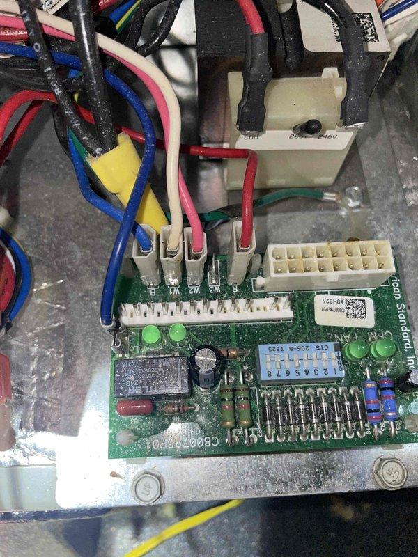 Returned to property to install replacement fan control board previously sold to customer. Removed existing defective control board from HVAC unit and installed new OEM green circuit board with integrated display and LED indicators. Connected all necessary wiring harnesses including power, control signals, and sensor inputs to appropriate terminals on the new board. Verified all wire connections were secure at terminal blocks and tested system operation. Unit powered up successfully with proper LED indication and fan motor operation confirmed.