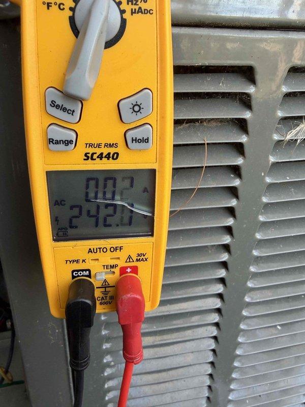 Completed routine AC tune-up on four-year-old cooling system. Performed standard maintenance procedures including electrical measurements using clamp meter, recording amperage draw of 5.08A and voltage readings on outdoor unit. Inspected condenser coil fins and overall system operation, confirming equipment is functioning within normal parameters.