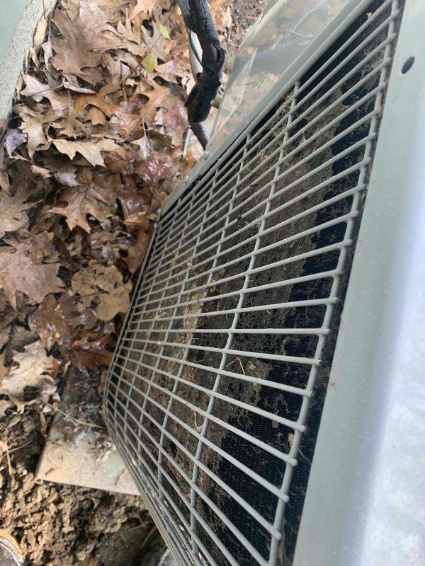 Performed routine AC tune-up on residential outdoor condensing unit. Cleared accumulated leaves and debris from around unit base and exterior grilles, inspected electrical connections, verified proper airflow through coil fins, and confirmed unit operational status. System operating within normal parameters upon completion of maintenance visit.