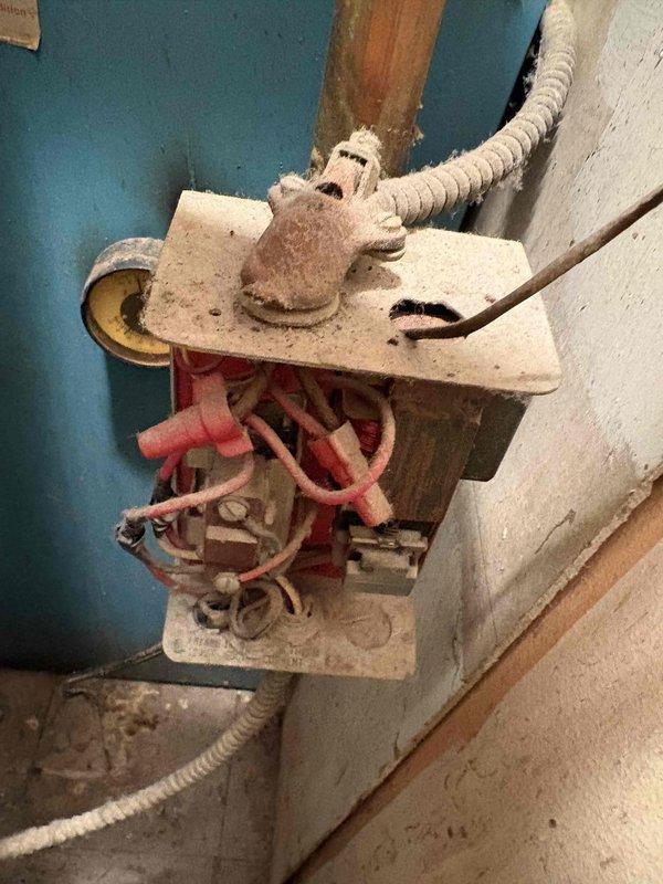 Responded to service call for non-operational 1978 boiler system. Upon inspection, confirmed complete failure of existing boiler unit requiring full replacement. Documented existing installation including wall-mounted components, piping configuration, electrical junction box with wire connections, and overall mechanical room setup. Prepared comprehensive replacement estimate for new boiler system installation.