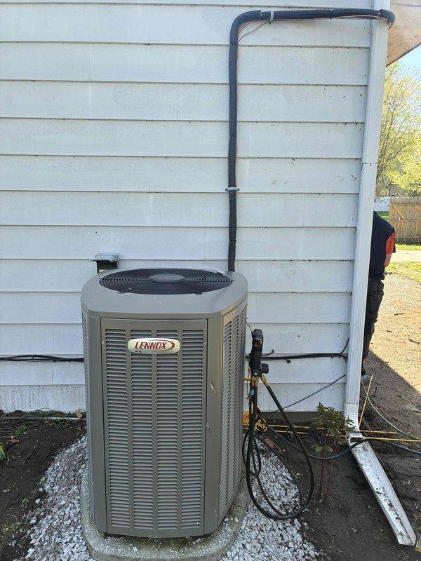 Relocated Lennox condenser unit to accommodate residential addition. Recovered refrigerant from system per EPA guidelines, disconnected and removed existing unit from original pad, and reinstalled on new concrete pad at designated location. Verified proper leveling of unit on pad, reconnected refrigerant lines and electrical conduit, recharged system, and confirmed operational functionality upon completion of electrical work at new location.
