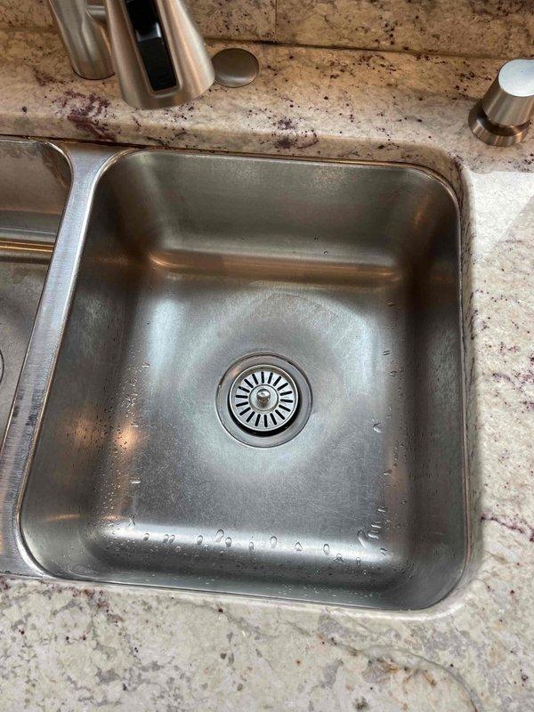 Completed comprehensive plumbing service including water heater flush, expansion tank replacement, and repair of multiple leaking fixtures. Addressed leaking kitchen faucet and drain assembly, replaced faulty washing machine supply hoses, and installed smart water shut-off system with monitoring capabilities for leak detection and automatic water supply control. All fixtures tested and confirmed operational upon completion.