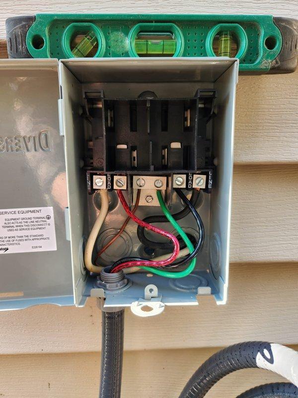 Completed full HVAC system installation including new outdoor condensing unit and associated electrical components. Installed outdoor disconnect box with proper wiring connections and verified level installation of all equipment. Removed and sealed both basement registers on the supply trunk per specifications. All electrical connections properly terminated and secured. System positioned on level pad, equipment leveled and verified operational.