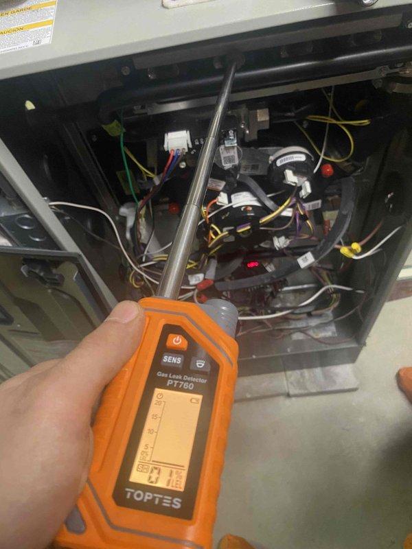 Responded to gas odor complaint near furnace. Performed comprehensive gas leak detection using calibrated electronic detector throughout unit interior, testing all gas connections, valves, and supply lines. Inspected burner compartment, heat exchanger, gas valve assembly, and all associated fittings while monitoring for combustible gas presence with specialized detection equipment.