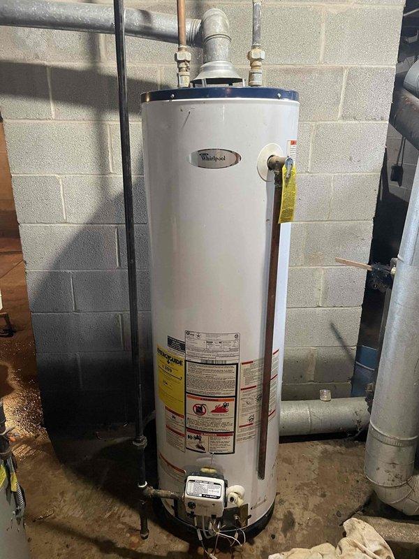 Responded to basement flooding emergency with suspected sump pump failure. Upon arrival, assessed water damage and moisture conditions in basement utility area. Evaluated HVAC system's ability to assist with moisture removal and documented existing conditions of water heater and mechanical systems affected by flooding.