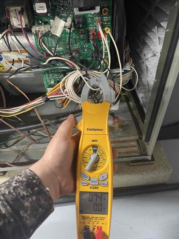 Completed routine HVAC club maintenance visit on air handler system. Performed diagnostic testing using clamp meter to verify electrical readings and system operation, with measurements indicating normal amperage draw. Conducted internal ductwork inspection using borescope camera to assess cleanliness and condition of flexible duct system, documenting interior surfaces and airflow pathway for maintenance records.