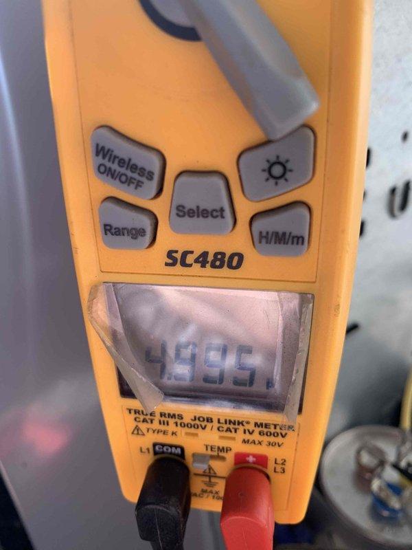 Completed routine AC tune-up on 3-year-old cooling system. Performed comprehensive system diagnostics using digital multimeter to verify electrical performance and measure operating parameters. System tested within normal operating specifications with capacitor reading 476.7 MFD and voltage reading 49.95V. All components functioning properly with no deficiencies noted at time of service.