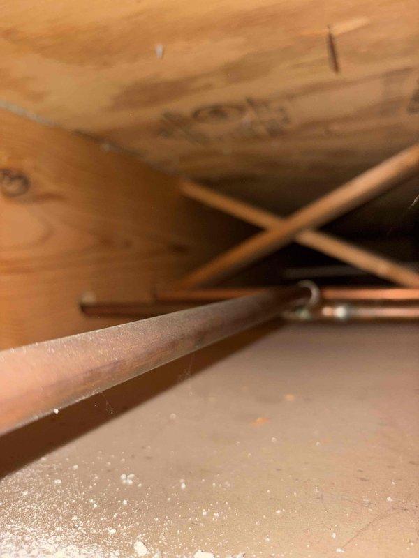 Conducted comprehensive plumbing assessment in attic/crawl space for kitchen remodeling project requiring relocation of existing plumbing fixtures. Evaluated current copper supply line routing, structural framing constraints, and access points to determine scope of work needed to relocate plumbing connections to accommodate new kitchen layout design.
