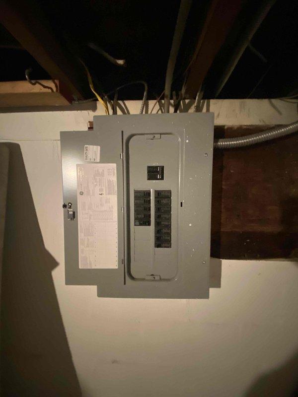 Conducted site assessment for mini split installation to supplement existing baseboard heating system. Customer requires cooling capacity for rooms located on opposite sides of residence. Evaluated electrical panel capacity and available breaker spaces in basement to determine feasibility of supporting two mini split units. Documented current electrical infrastructure including main panel configuration and available circuit capacity. Based on room layout and distance between target areas, recommended dual mini split system installation with separate outdoor condensing units to efficiently serve opposite sides of home.