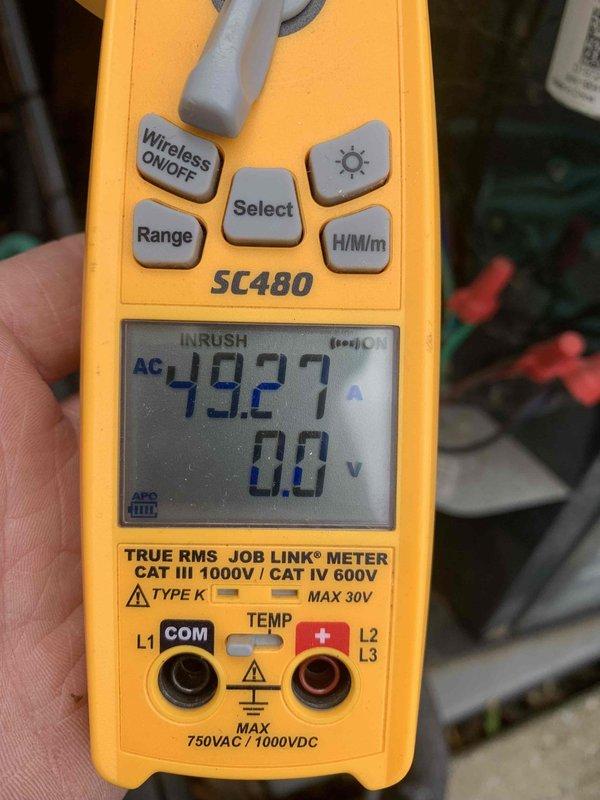 Completed routine AC tune-up on 6-year-old cooling system. Performed standard maintenance procedures including electrical testing with multimeter, which showed normal inrush current readings. Observed significant rust and corrosion on mounting brackets and refrigerant line connections during inspection. System currently operating within normal parameters despite visible oxidation on hardware components.