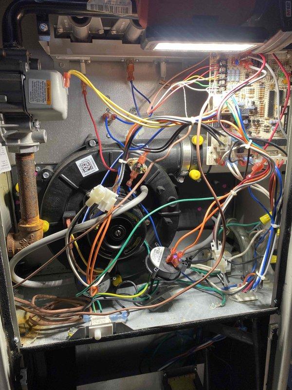 Returned to site to complete previously sold repair work involving replacement of faulty pressure switch and collector box cover. Accessed HVAC unit interior, removed defective pressure switch from control assembly, and installed new pressure switch ensuring proper electrical connections to the control board and safety circuit. Replaced damaged collector box cover to restore proper unit enclosure and maintain safe operation. Verified all wire connections were secure, tested pressure switch operation through system cycling, and confirmed unit returned to normal heating operation with all safety controls functioning correctly.