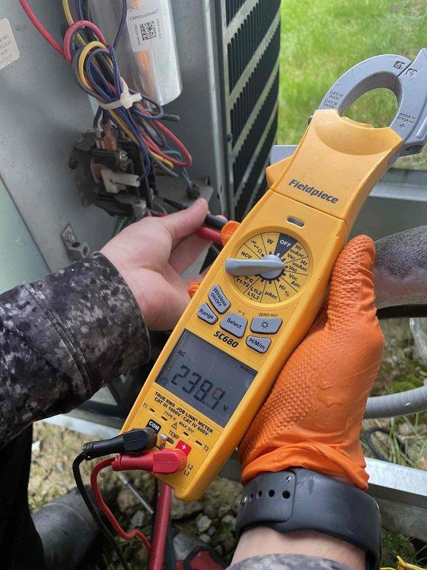 Completed comprehensive air conditioning tune-up on 5-year-old system per customer request. Performed standard maintenance protocol including temperature differential measurements, electrical diagnostics with amp draw readings showing 22.98 amps, and capacitor inspection. System found operating within normal parameters with no deficiencies noted.