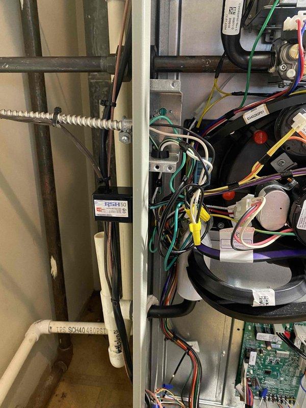 Returned to commercial rooftop location to complete installation of four surge protection devices on HVAC equipment as previously sold. Successfully installed surge protectors on multiple rooftop units, integrated devices into existing electrical disconnects and control circuits, verified proper wiring connections and grounding, and confirmed all units operational with surge protection active.