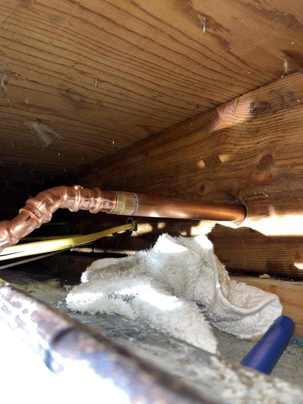 Responded to water leak in drop ceiling caused by failing copper pipe joint. Upon inspection, discovered active leak at copper elbow connection with visible water damage and moisture accumulation in surrounding area. Removed damaged section of copper piping and installed new copper fittings with proper soldering techniques to ensure watertight seal. Tested repaired connection under full pressure to verify leak was completely eliminated. Additionally, replaced exterior hose spigot as requested, removing old fixture and installing new frost-proof sillcock with proper pitch for drainage. All work completed to code specifications and system restored to full operation.
