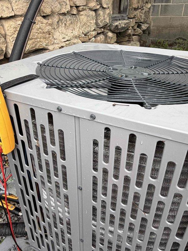 Completed comprehensive air conditioning tune-up on a 2-year-old system with no reported equipment issues. Performed standard maintenance protocol including system diagnostics, electrical measurements showing 24.6 amps draw, visual inspection of outdoor condenser unit, and verification of proper operation. All components found functioning within normal parameters with unit operating efficiently.
