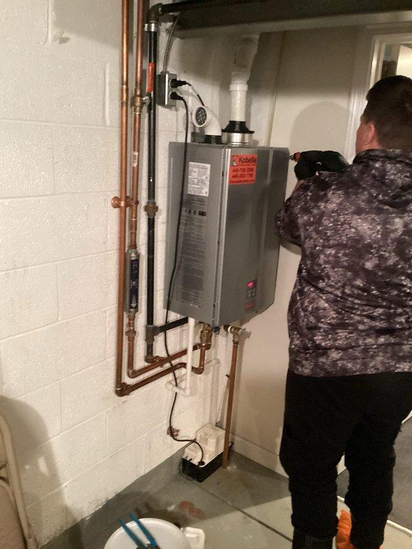 Completed plumbing maintenance membership visit including comprehensive inspection of residential plumbing systems. Performed visual assessment of wall-mounted tankless water heater unit, examining copper supply lines, PVC venting system, condensate drain connections, and all associated fittings and valves for proper operation and potential issues. Customer was informed that tankless water heater flushing service is not included under the standard membership coverage.