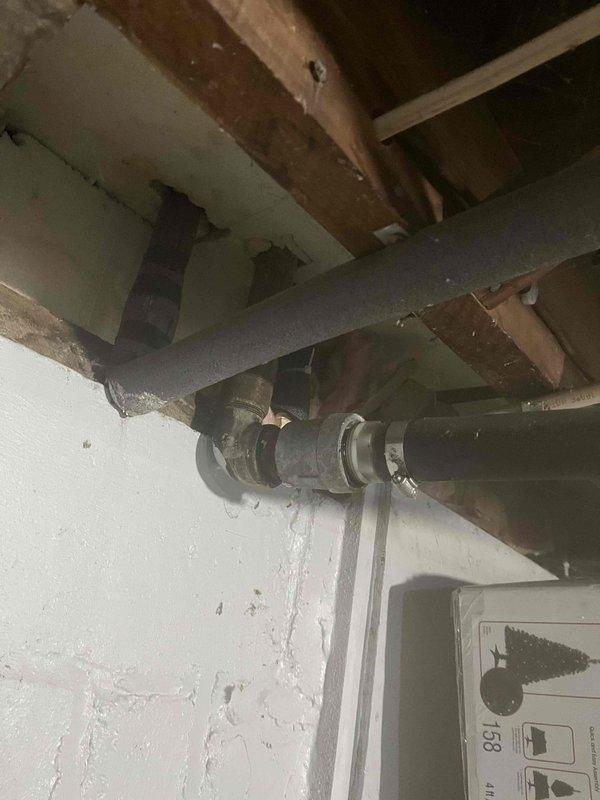 Responded to water leak complaint originating from bathtub drain assembly. Upon inspection, identified failed drain gasket and deteriorated plumber's putty causing water to seep past the drain connection during tub use. Accessed the drain assembly from below through basement ceiling, requiring work in confined space among existing plumbing and HVAC infrastructure.

Removed existing drain fitting and thoroughly cleaned all mating surfaces of old sealant and debris. Installed new drain assembly with fresh plumber's putty and rubber gasket, ensuring proper compression and seal. Secured all connections with appropriate torque to prevent future leaks while avoiding over-tightening that could crack the tub surface. Applied PVC pipe support clamps to adjacent drainage lines to eliminate stress on connections and prevent future movement-related failures.

Tested repair by filling tub and releasing water multiple times while monitoring drain connection from below for any signs of moisture. Conf