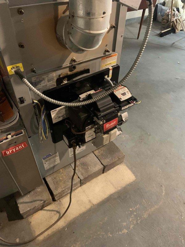 Responded to emergency service call for unusual odor emanating from 10-year-old Bryant furnace system. Upon inspection, identified and assessed gas valve assembly and electrical connections for potential issues causing the reported smell. Examined furnace operation, verified proper combustion, and inspected all mechanical components including flex conduit connections and control modules to ensure system safety and proper functionality.