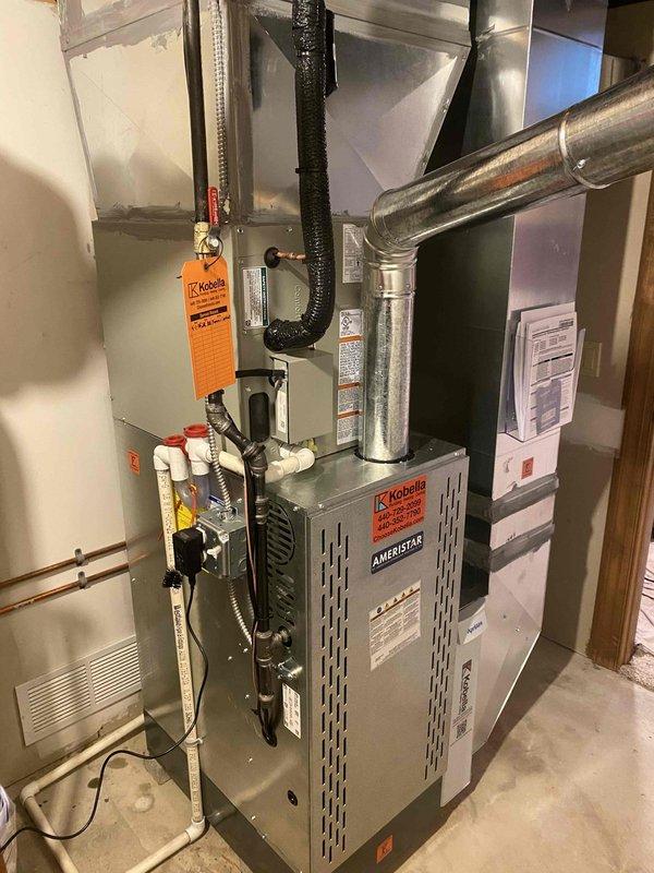 Completed full HVAC system installation including American brand furnace unit with associated ductwork, ventilation components, and control systems. Installed rigid metal supply and return ductwork with flexible insulated sections, connected PVC condensate drainage and copper refrigerant lines, mounted thermostat control panel, and verified all connections meet code requirements. System tested and operational upon completion.