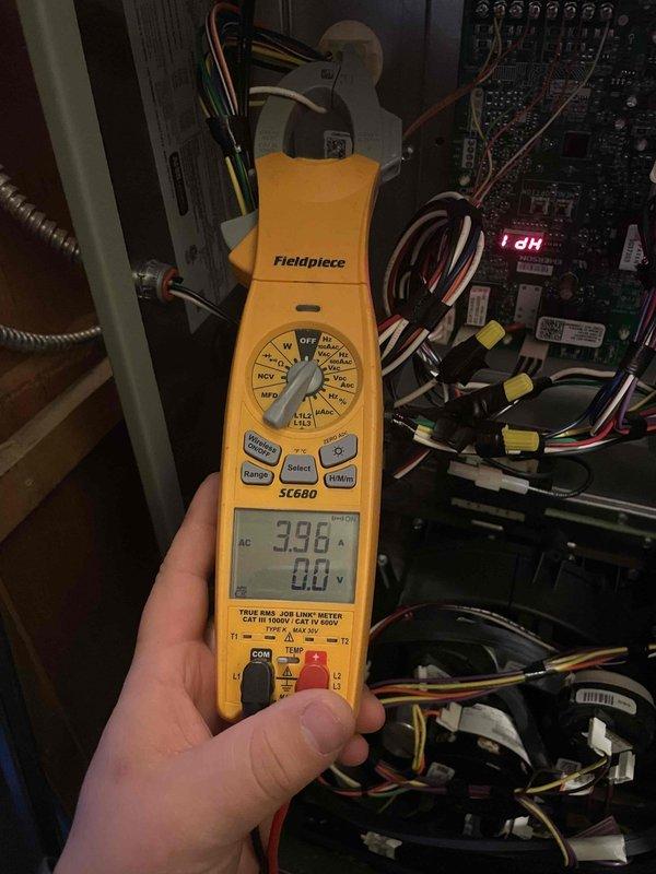 Completed cooling maintenance on HVAC system per customer request for technician continuity. Performed diagnostic testing using digital multimeter to verify electrical readings at control board, confirming proper voltage levels at 396V and system operation within manufacturer specifications. Inspected Emerson control board and all associated wiring connections, terminal blocks, and electronic components for signs of wear or deterioration—all found to be in good working condition with clean solder joints and secure connections.