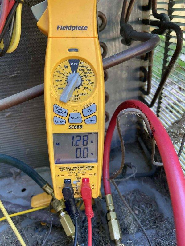 Completed routine cooling maintenance member visit on residential HVAC system. Performed comprehensive system diagnostics using digital multimeter to verify electrical performance and amperage draw. Measured operating current at 128 amps and confirmed voltage readings within manufacturer specifications. Conducted temperature differential testing, recording 87.1°F at outdoor unit. Inspected refrigerant lines, copper piping, and condensing unit components for proper operation and integrity. All measurements indicated system operating within normal parameters. No deficiencies noted. Unit left in proper working condition.