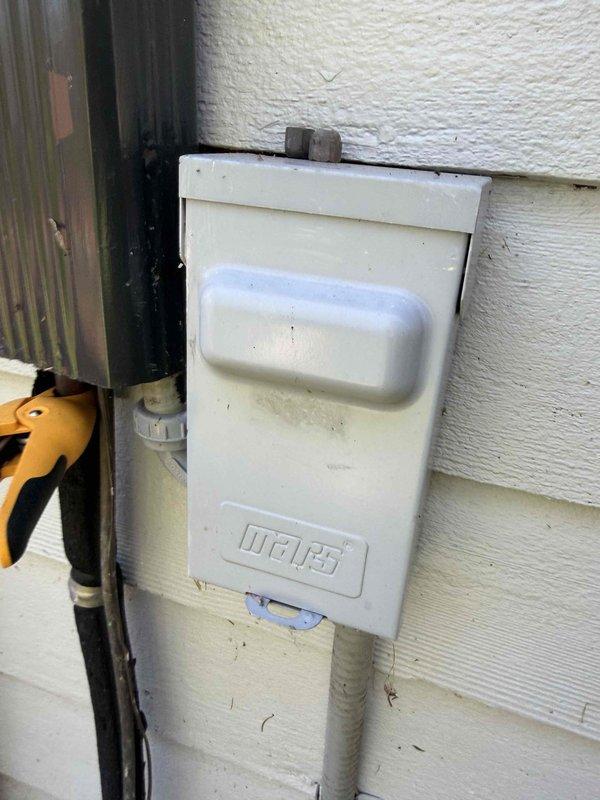 Completed comprehensive AC tune-up on 16-year-old cooling system. Performed standard maintenance protocol including inspection of exterior disconnect box, verification of electrical connections, and amperage draw testing which measured 5.02 amps using clamp meter. Exterior disconnect showed age-appropriate weathering with minor surface corrosion on mounting hardware but remained fully functional. All electrical components tested within normal operating parameters for unit age and specifications.
