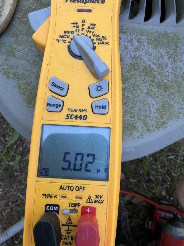 Completed comprehensive AC tune-up on 16-year-old cooling system. Performed standard maintenance protocol including inspection of exterior disconnect box, verification of electrical connections, and amperage draw testing which measured 5.02 amps using clamp meter. Exterior disconnect showed age-appropriate weathering with minor surface corrosion on mounting hardware but remained fully functional. All electrical components tested within normal operating parameters for unit age and specifications.