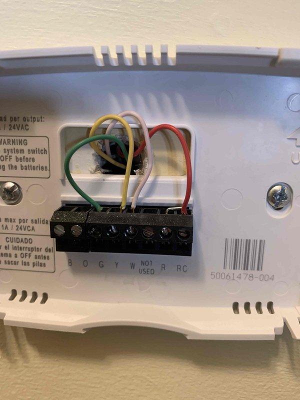 Responded to callback for continuously running air handler fan drawing 65 watts. Inspected thermostat wiring connections and verified proper terminal assignments at both the wall control and air handler control board. Found thermostat G-terminal wire connection causing fan to run in continuous mode rather than automatic cycling. Corrected wiring configuration, tested system operation through multiple heating and cooling cycles, and confirmed air handler fan now operates properly in auto mode with appropriate on/off cycling.