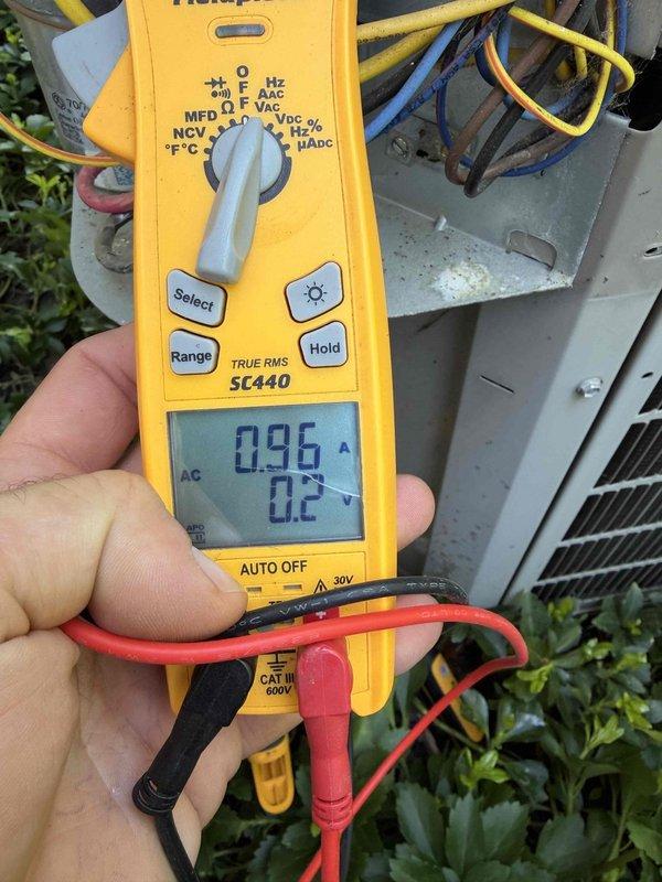 Completed cooling maintenance on air handler unit as part of club membership service. Performed electrical diagnostics using clamp meter, recording amperage draw of 0.96A and voltage reading of 0.2V to verify proper system operation. Inspected and serviced fuse assembly, removing Edison-brand fuses from exterior disconnect for testing and evaluation. All electrical components checked for proper function and safety compliance.